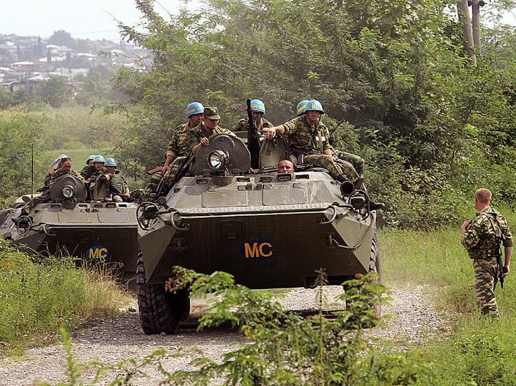 Russian military near Kharkiv border bear “peacekeeper” markings ~~