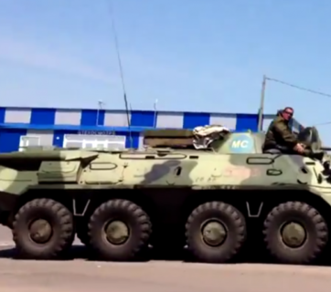 Russian military near Kharkiv border bear “peacekeeper” markings