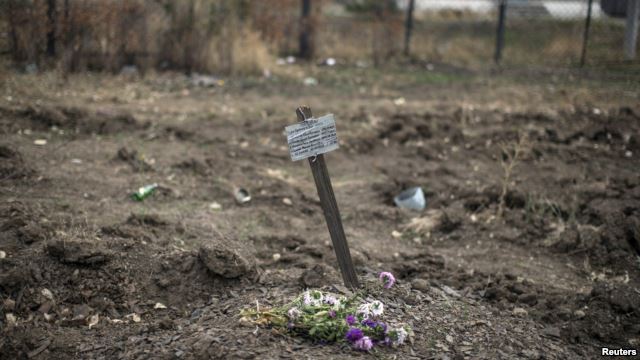 Plaque on a grave: ‘They died for Putin’s lies’
