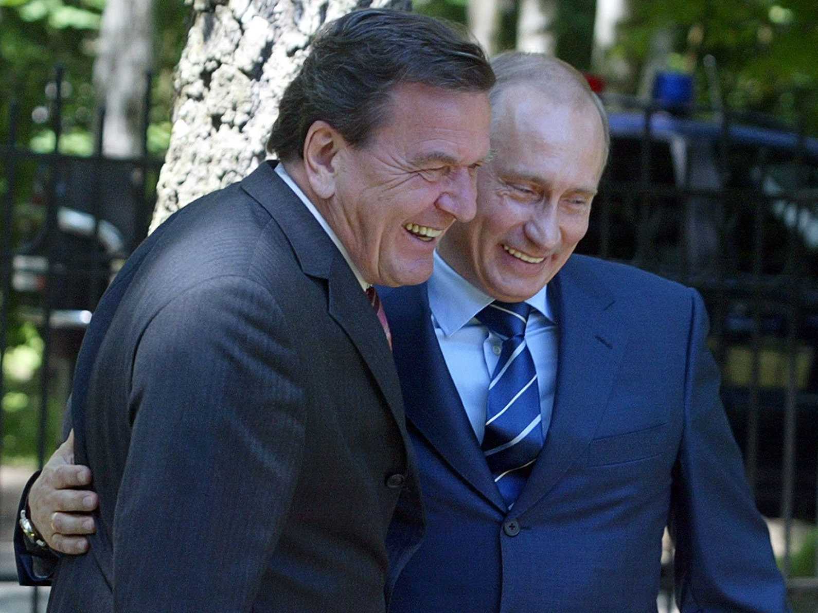 Gerhard Schröder, former Chancellor of Germany (1988-2005) who became top GAZPROM representative in the country after leaving his government position, with Vladimir Putin