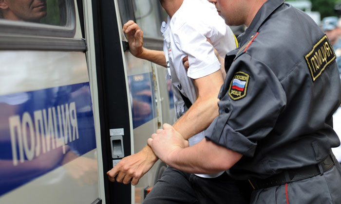 Russian policeman with an arrested