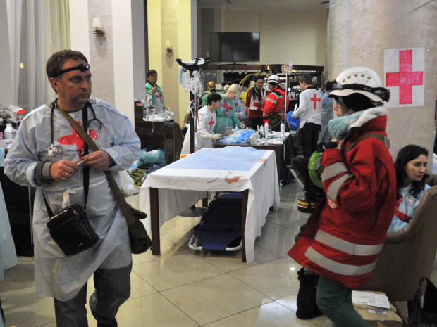 Medics and volunteers arrange a field hospital an hotel hall near Independence square in Kiev on February 20, 2014.