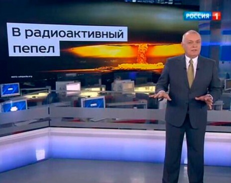 Head of the Kremlin's Rossiya Segodnya news agency Dmitry Kiselyov projecting the image of a nuclear mushroom cloud and boasting Russia's ability to turn US "into radioactive ash." (Image: screen capture)