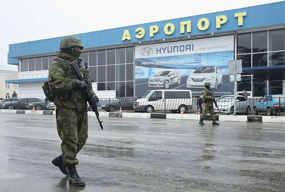 Russian "green men" patrolling the airport in Simferopol, the capitol of Crimea, February 2014. Russian military occupied the peninsula almost a month in advance of the illegal "referendum."