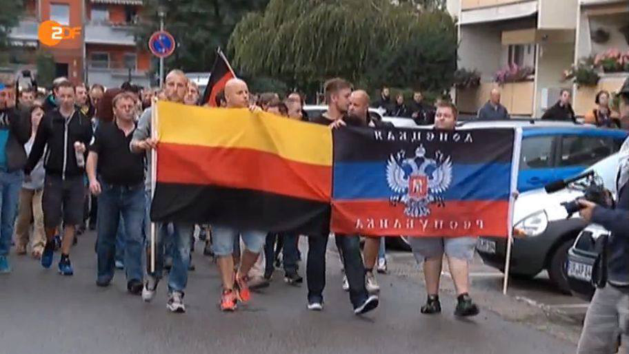 German neo Nazis carry “DNR” flag while Kremlin tries to portray it as anti fascist