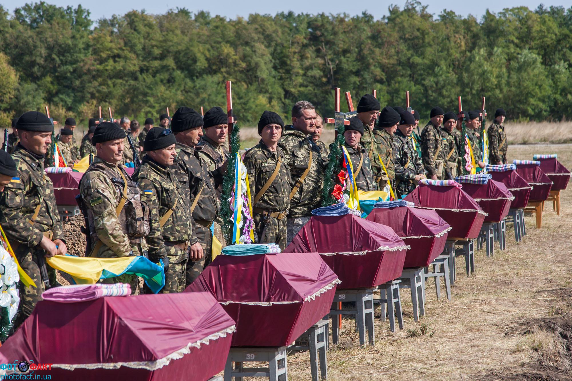 A funeral for unidentified soldiers killed in action liberating the Donbas region of Ukraine from the hybrid army of the Russian Federation. The funeral was held in the town of Kushugum, Zaphorizhze oblast, on October 1, 2014.