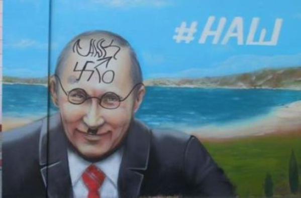 Russian propaganda murals in Crimea are getting defaced with graffiti reflecting the Crimeans' real feelings toward Putin and his occupation of their land, which are very different from the supposed results of the fake "referendum" conducted by the Russian occupation force. (Photo: social media, October 2015)