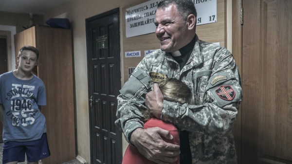 A chaplain called “Dad” and father to 33 children