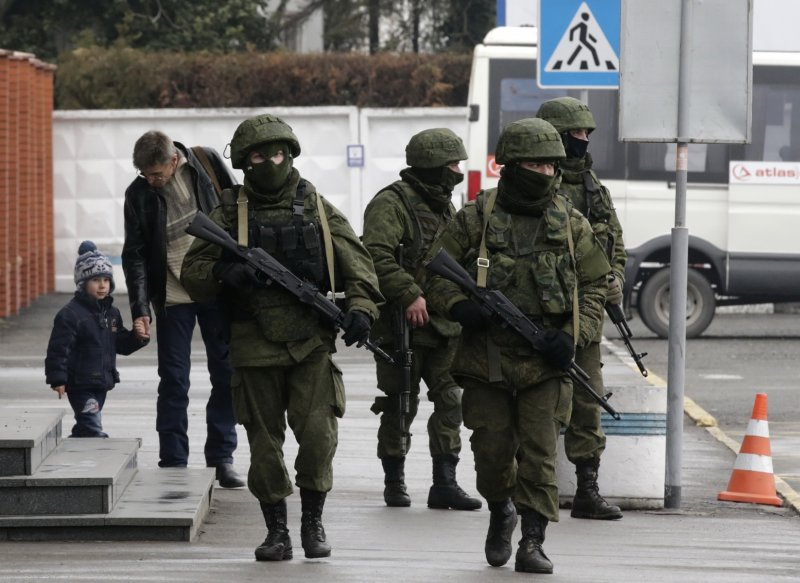 Russian cadres troops disguised in unmarked uniforms, face masks and body armor carry out heavily armed patrols in the streets of Crimea to suppress any popular resistance to the invasion. February 2014. (Image: molbuk.ua)