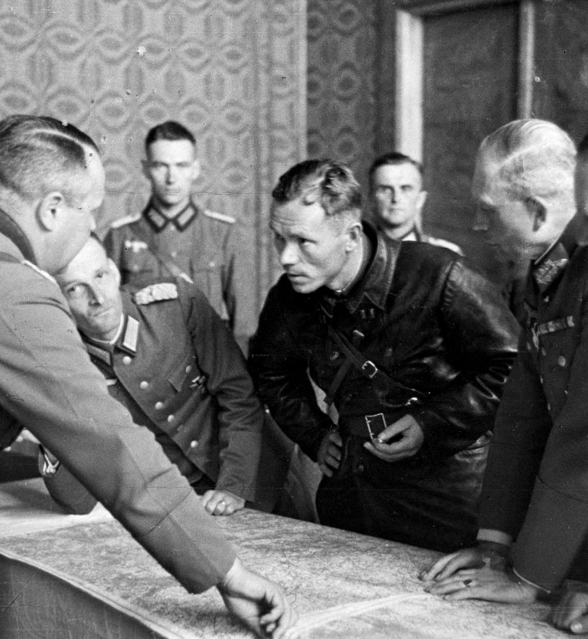 German generals headed by Heinz Guderian conversing with battalion political commissar of the 29th Soviet Tank Brigade Vladimir Borovitsky in occupied Brest