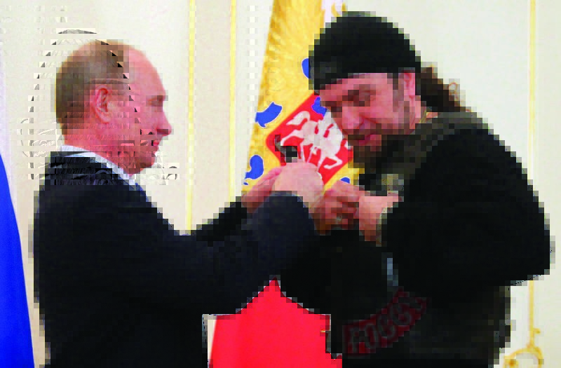 Putin awards Russia's Order of Honor to the leader of a Moscow biker group financed by the Putin government Alexander Zaldostanov (aka "the Surgeon"). The group serves important propaganda functions in the Russian hybrid war and actively participated in Putin's Anschluss of Crimea. (Image: Mikhail Klimentyev/RIAN)
