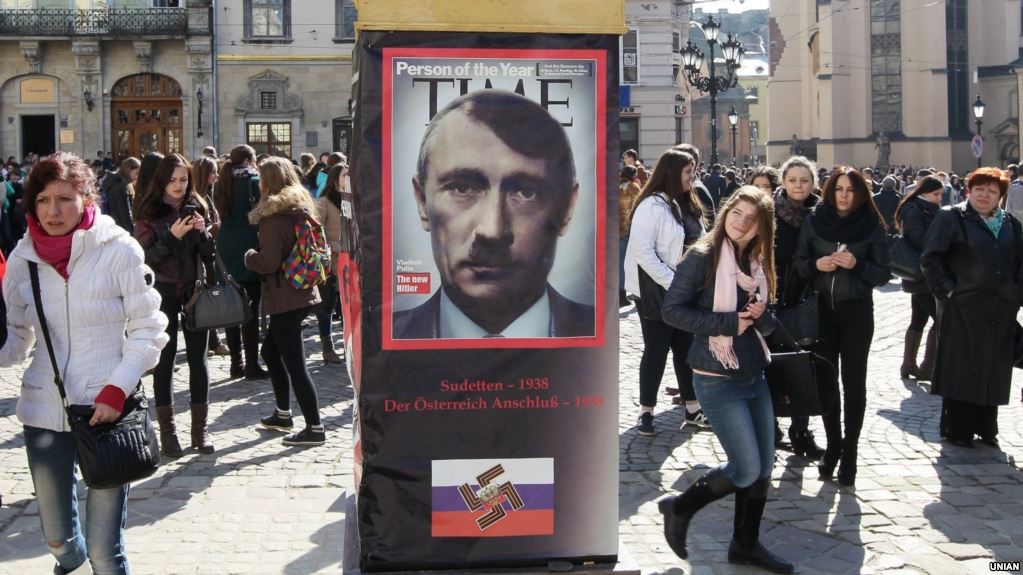 "Pillar of shame" displaying Putin's "The Time Magazine Person of the Year" cover page. March 11, 2014 in Lviv, Ukraine (Image: UNIAN)