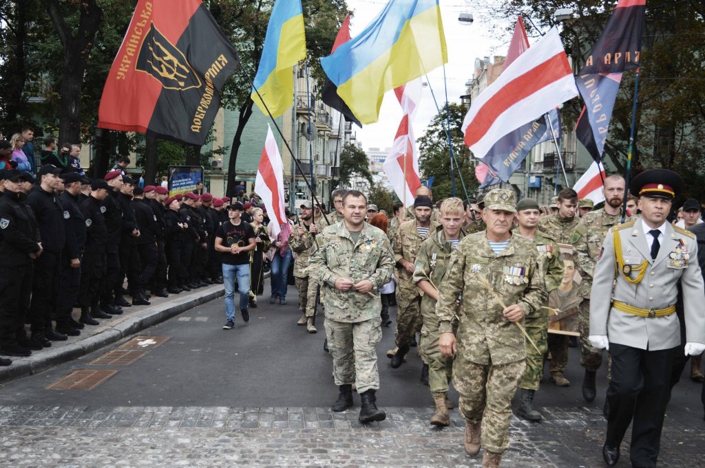 Relatives of soldiers killed in Donbas war march in alternative “parade ...