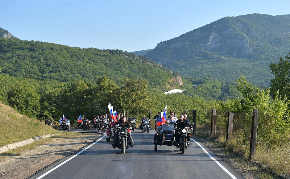 Vladimir Putin riding a three-wheel motorcycle carrying the top two officials of the Russian occupation administration for Crimea Sergey Aksyonov and Mikhail Razvozhayev and being escorted by members of Moscow's Night Wolves biker club. Crimea, August 10, 2019. Photo: kremlin.ru