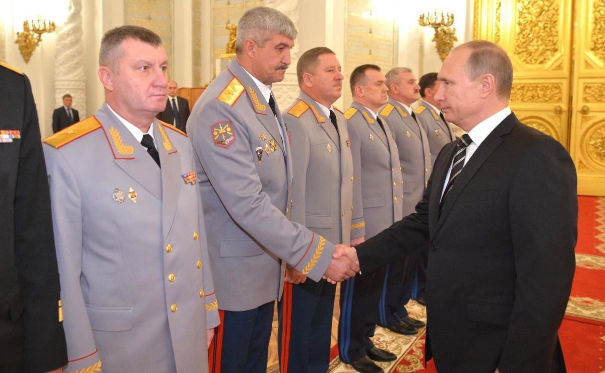 Putin holding hand of Kuzovlev - Russian active-duty military general who participated in Russian invasion of Donbas.