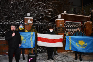 Activists from Kyiv fly the flags of Belarus and Kazakhstan in the action of solidarity with the protesters of Kazakhstan