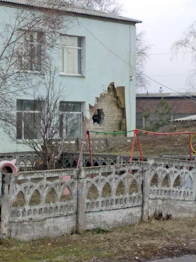 Damaged building of the kindergarten-nursery #21 Kazka in Stanytsia Luhanska after a shell hit on 17 February 2022. Photo: Facebook / Операція об'єднаних сил / Joint Forces Operation ~