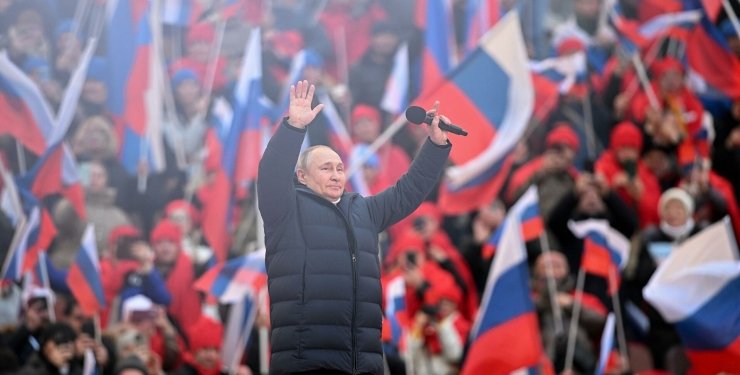 Russian President Vladimir Putin speaks at a propaganda concert dedicated to the 8th anniversary of the occupation of Crimea and current war against Ukraine at the Luzhniki stadium in Moscow. 18 March 2022. Credit: ria.ru