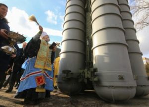 A Russian Orthodox priest of the Moscow Patriarchate blesses a Russian S-300 nuclear-capable long range surface-to-air missile system. Photo: Aleksei Pavlischak / TASS