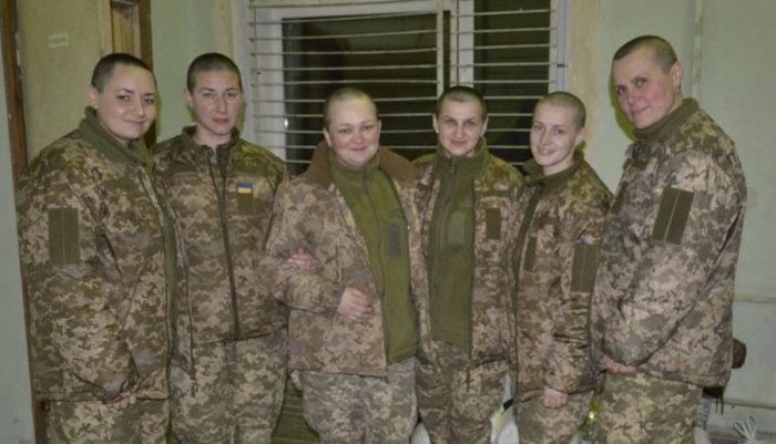 Ukrainian women POWs stand proud with shaven heads after prisoner swap with Russia