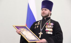 The head of the Bryansk Eparchy's department for relations with the military and police, priest Mikhail Ageshin wearing his military medals (Source: bryansk-eparhia.ru)