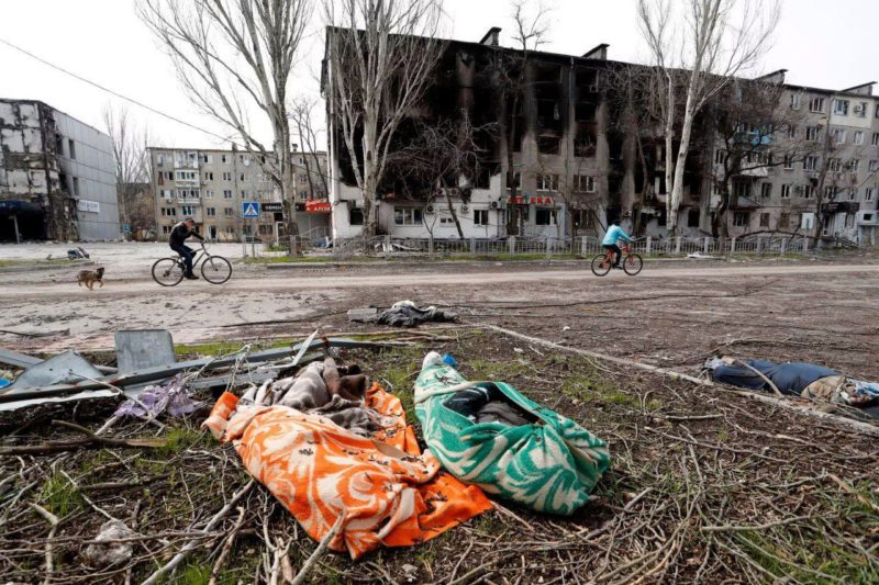 dead bodies in mariupol; meanwhile russia deports those alive via filtration camps