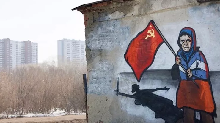 Russian propaganda invasion Ukraine grandma with a flag