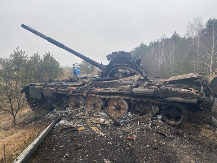 A destroyed Russian tank on the middle of the road to Bohdanivka