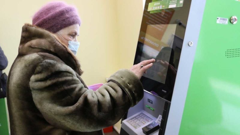 A grandma using the ATM machine in Russia