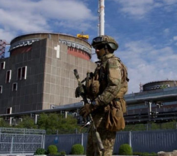 Russian troops stand near the Zaporizhzhia NPP
