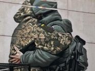 Mural with embrace of Ukrainian and Russian soldier taken down in Melbourne – PHOTOS