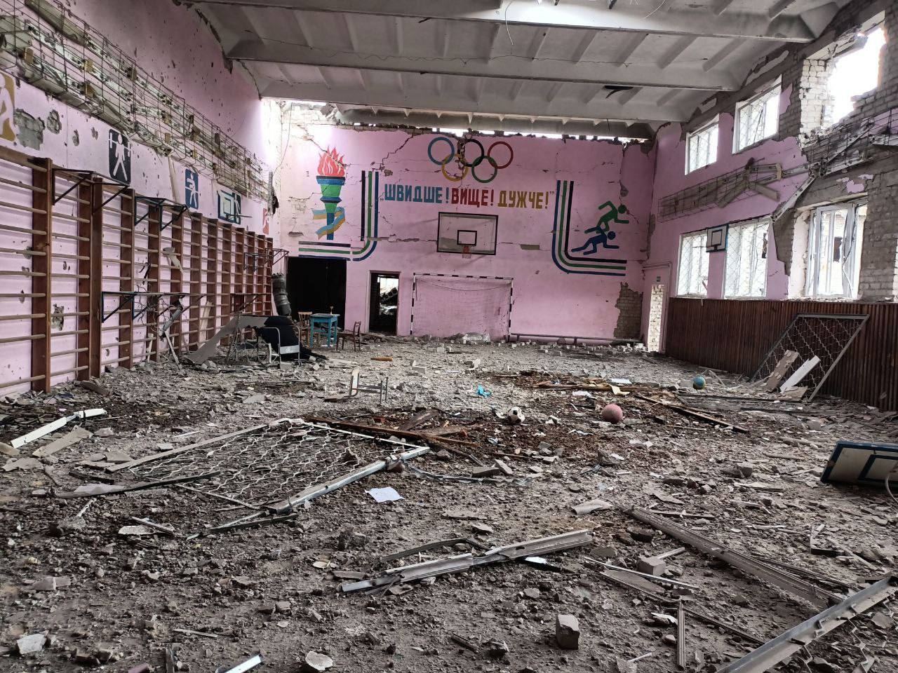 A school gym stands in ruins, having suffered bombardment during the Russian occupation. Credit: Nataliya Bordiychuk ~