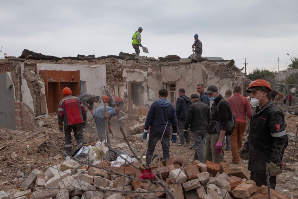 Cleaning up the rubble of homes destroyed in a Russian missile strike in Zaporizhzhia. Photo: Kris Parker ~