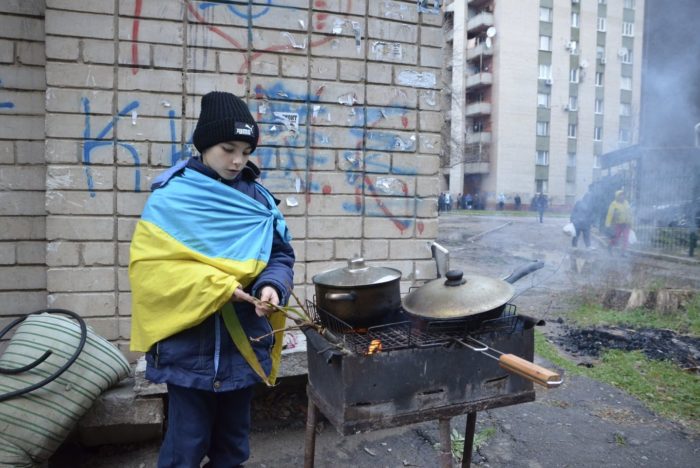 Kherson boy wrapped in Ukrainian flag