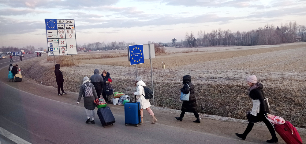 Ukrainian refugees at the Polish border, February 2022. Credit: depositphotos ~