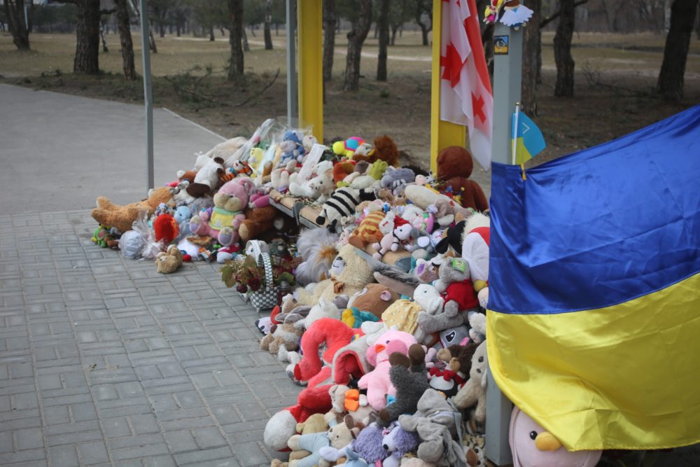 Dnipro residents brought toys to a bus stop opposite to Building 118 that was hit by Russian missile strike on 14 January 2023. Photo by Euromaidan Press ~